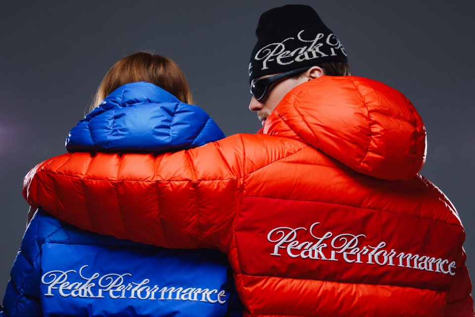 Two models in red and blue Peak Performance 40Y down jackets